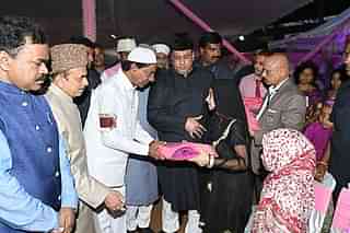 The Telangana CM distributing gifts to Muslims. (pic via Twitter)