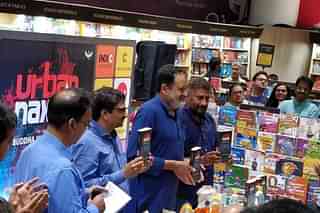 Mohandas Pai, former CFO of Infosys, fourth from left, launches the book written by filmmaker Vivek Agnihotri, to Pai’s left, at Crossword book store, Mantri Mall, Malleswaram, Bengaluru, on 17 June. (IndicAcademy/Twitter)