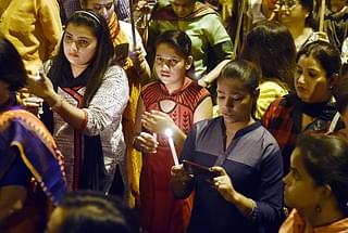 Delhi BJP Youth Wing observes a candle light march demanding justice for the rape victim  at Rajpath on 25 April