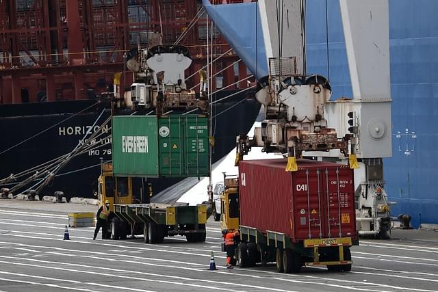 Shipping containers are offloaded from the Hong Kong based CSCL East China Sea container ship at the Port of Oakland  in Oakland, California. (Justin Sullivan/GettyImages)&nbsp;