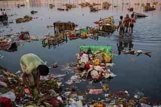 Refuse left over after immersing idols of Goddess Durga into the Yamuna river (Daniel Berehulak/Getty Images)