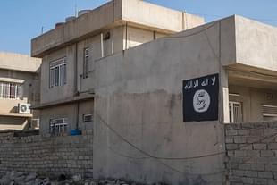 A house in Bartella with the ISIS flag painted on the wall. (Joseph Galanakis/NurPhoto via Getty Images)