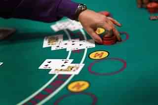 A dealer works the blackjack table (Joe Raedle/Getty Images)