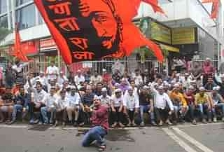 Maratha protestors carry a flag of Chhatrapati Shivaji in Lalbaug, Mumbai (Bhushan Koyande/Hindustan Times)