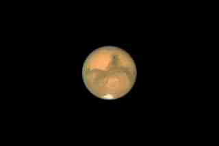 A picture of the Red Planet released by NASA. The southern polar ice cap is visible in the picture. (NASA/Getty Images)