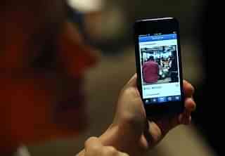 A Facebook employee demonstrates the new Instagram video option. (Justin Sullivan/Getty Images)