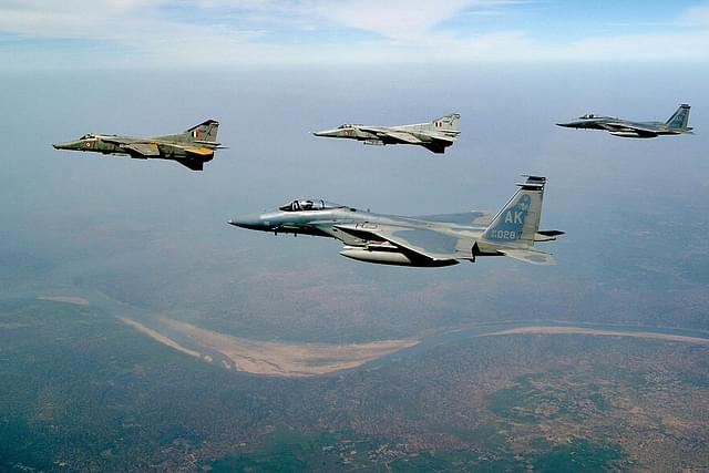 Two USAF F-15 Eagles and two IAF MIG-27 Floggers flying in formation during Cope India 2004. (US Air Force/Wikipedia)