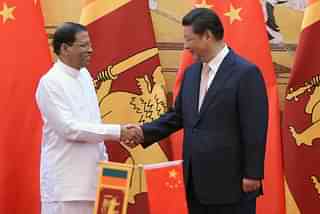 Sri Lankan President Maithripala Sirisena and Chinese President Xi Jinping shake hands. (Feng Li-Poo/Getty Images)