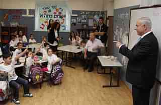 Israeli Prime Minister Benjamin Netanyahu talking at a Jewish kindergarten in 2012 (Gali Tibbon - Pool/Getty Images)