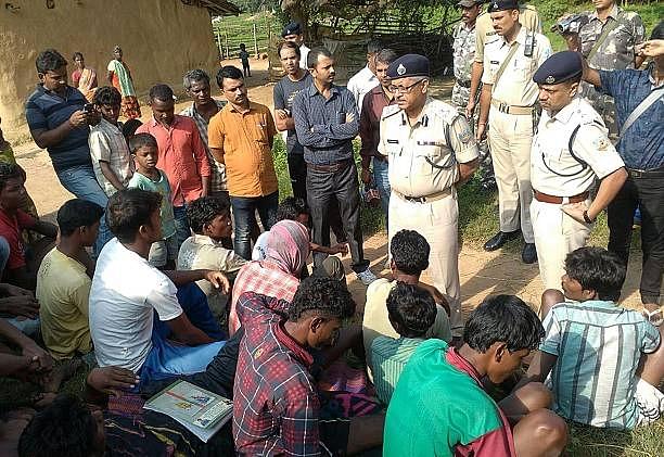 Police talk to villagers in Kanjia village in eastern Jharkhand. (STR/AFP/Getty Images)