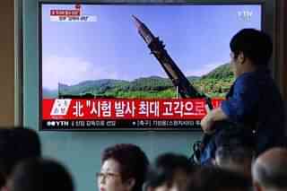 South Koreans watch a North Korean missile test. (Chung Sung-Jun/Getty Images)