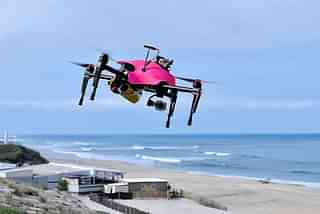 A surveillance drone flies over the beach of Biscarrosse, during
a demonstration of a rescue operation. Photo credit: GEORGES GOBET/AFP/GettyImages