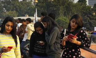 People use free WiFi provided by Tata Docomo at Connaught Place in Delhi in 2014 (Arvind Yadav/Hindustan Times via Getty Images