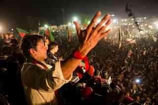 Imran Khan, chairman of the Pakistan Tehrik e Insaf (PTI) party, addresses supporters during an election campaign rally. (Daniel Berehulak/Getty Images)