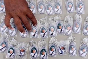 A man sorts key chains of Mother Teresa at Blessed Mother Teresa Church in Virar near Mumbai. (Pratham Gokhale/Hindustan Times via GettyImages) 