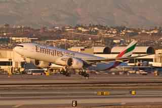 An Emirates Boeing 777-200LR takes off from Los Angeles International Airport, California
