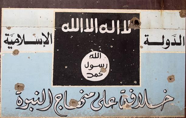 A picture shows a mural depicting the emblem of the Islamic State. (AHMAD AL-RUBAYE/AFP/Getty Images)