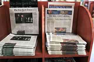  An issue of <i>The Wall Street Journal </i>is placed beside <i>The New York Times. </i>(Spencer Platt/Getty Images)