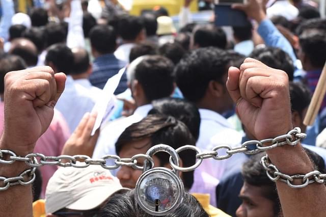 Dalits stage a protest against a Supreme Court order which allegedly dilutes the SC/ST (Prevention of Atrocities) Act in Lucknow, India. (Subhankar Chakraborty/Hindustan Times via GettyImages)