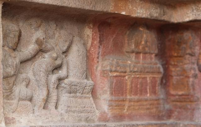 Thiruneelanakka Nayanar's wife blowing on the deity.