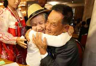 The reunion. (O Jong-Chan-Korea Pool/Getty Images)&nbsp;