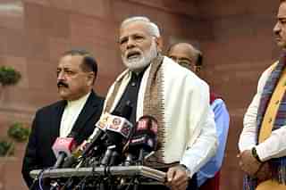 Prime Minister Narendra Modi with parliamentary affairs minister Ananth Kumar, minister of state Jitendra Singh addressing the media. (Arvind Yadav/Hindustan Times via Getty Images)