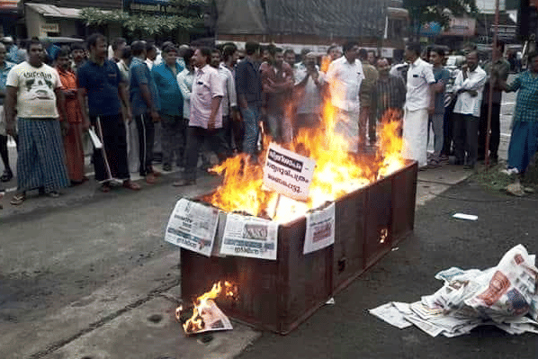 Nair Service Society members burning copies of Mathrubhumi in protest against its weekly magazine carrying parts of the novel ‘Meesha’. 