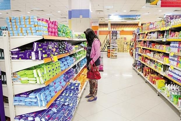 A woman buying sanitary napkins in a supermarket (Indranil Bhoumik/Mint via Getty Images)
