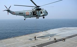 Sea Harrier flies past Indian Navy’s aircraft carrier.