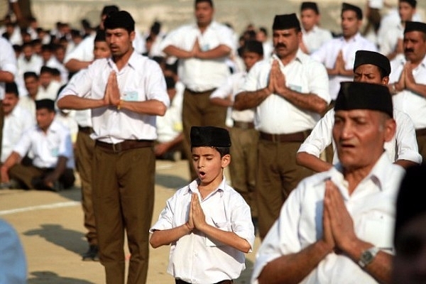 RSS volunteers performing yoga (Nitin Kanotra/Hindustan Times via Getty Images)
