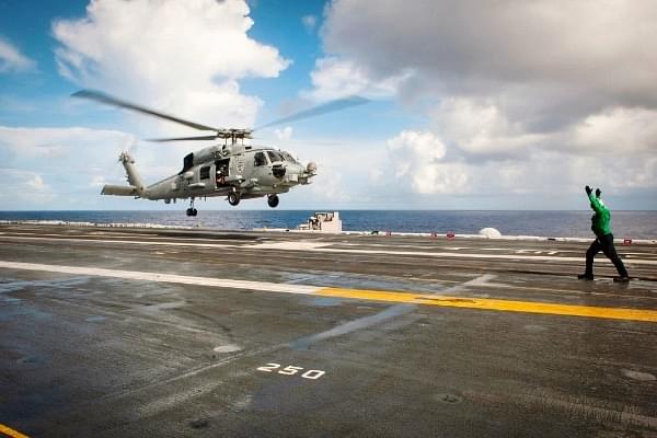 MH-60R helicopter to take off from the flight deck of the Nimitz-class aircraft carrier USS Carl Vinson during a search and rescue mission. 	<a href="https://www.flickr.com/photos/usmilitary/">(US Military/Flickr)</a>									