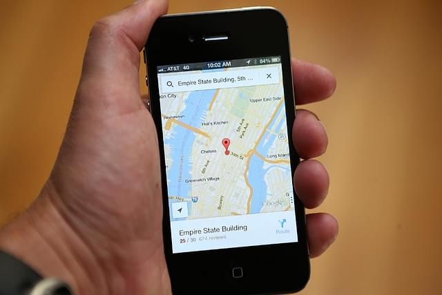 An iPhone user uses Google Maps in New York, United States (Justin Sullivan/Getty Images)