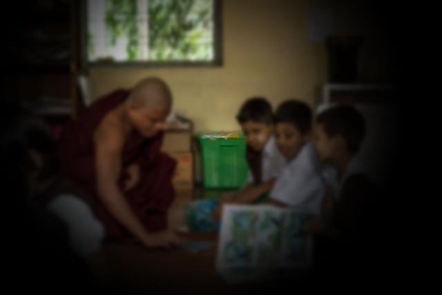 A Buddhist monk sits and teaches students before class. (Representative Image/Lauren DeCicca/Getty Images)&nbsp;