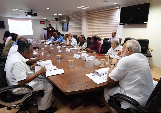 Prime Minister Narendra is reviewing the flood situation in Kerala. Alongside him to the left is Kerala Chief Minister Pinarayi Vijayan. (PMO India/Twitter)