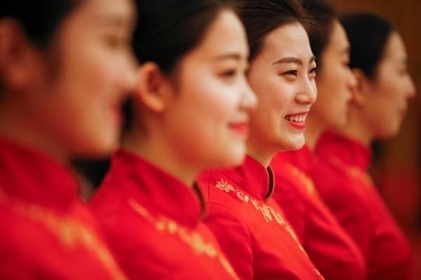 Waitresses smile before the welcoming banquet at the Great Hall of the People during the first day of the Belt and Road Forum in Beijing, China. (Photo by Damir Sagolj - Pool/Getty Images)