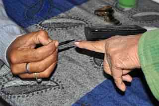A woman getting inked during the 2017 elections to the Himachal Pradesh legislative assembly (Shyam Sharma/Hindustan Times via Getty Images)