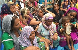 Women outside Sanjay’s uncle’s house on Wednesday