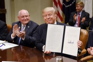 US President Donald Trump with  Agriculture Secretary Sonny Perdue. (Olivier Douliery-Pool/Getty Images)