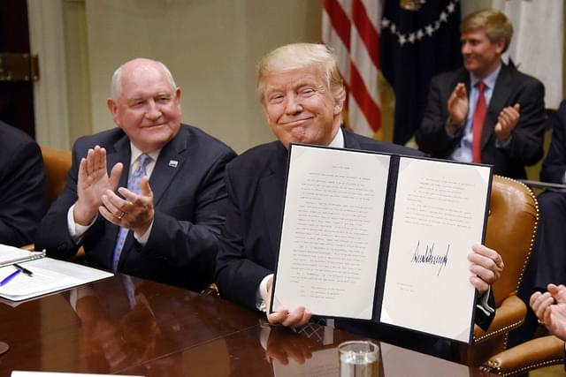 US President Donald Trump with  Agriculture Secretary Sonny Perdue. (Olivier Douliery-Pool/Getty Images)