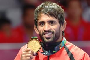 Punia with the gold medal. (pic via Twitter)