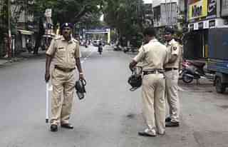 Police officers stand in Pune (Ravindra Joshi/Hindustan Times via Getty Images)