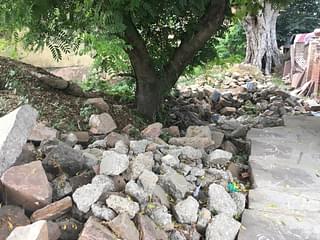 Ramesh Sharma has placed huge stones on a plot adjoining his house that once served as shelter for the cows.