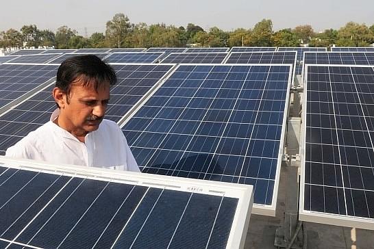 Madhya Pradesh Power minister Rajendra Shukla inaugurates solar power station at Power Discom office on November 17, 2015 in Bhopal, India (Photo by Mujeeb Faruqui/Hindustan Times via Getty Images)