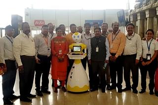 Staff at the Chennai Airport pose with the new Robot (@aaichnairport/Twitter)