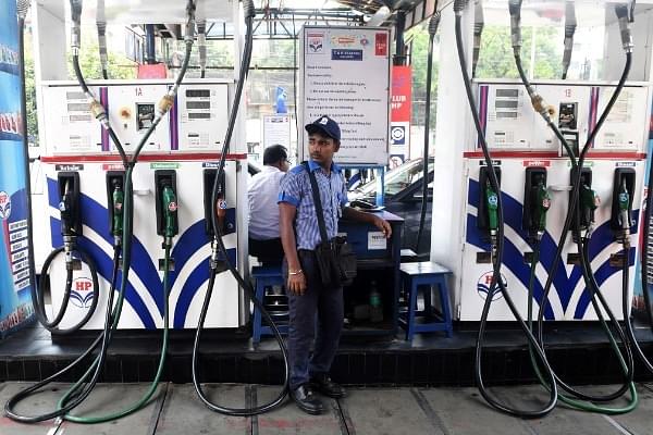 An Indian petrol pump attendant waits for customers at a gas station in Kolkata (representative image) (DIBYANGSHU SARKAR/AFP/Getty Images)