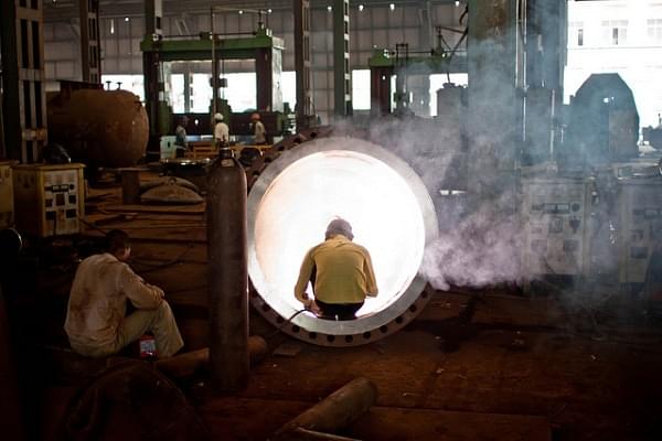 A welder in an Indian steel factory (Jay Hariani/Flickr)