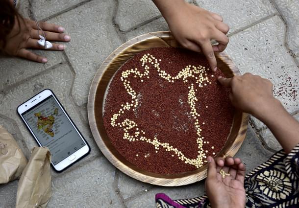 Students of Mount Carmel College doing art work with millets during a Millet Workshop for Nutrition. (Arijit Sen/Hindustan Times via Getty Images) 