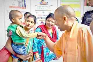 UP Chief Minister Yogi Adityanath at a programme for child healthcare. (pic via Twitter)