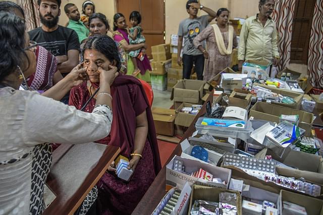 Residents seek treatment at a medical shelter in Chegannur relief camp in Kerala, India. (Atul Loke/Getty Images)&nbsp;