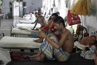 Patients at a government hospital in Kolkata (Deshakalyan Chowdhury/AFP via Getty Images)